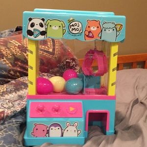 Kids claw machine fun with squishes as prizes